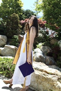 a woman in a graduation gown